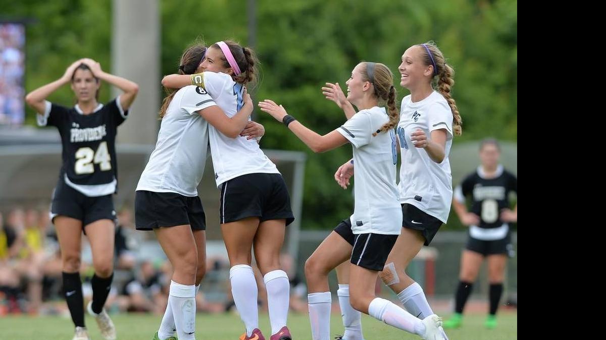 
Justine James (second from left) of Panther Creek celebrates the second goal of the N.C. 4A championship along with her teammates, Briana Velasquez (right) and Brittany Matsinger (second from right) and Sarah Barnes (right). Panther Creek beat Providence 2-0 Saturday at N.C. State.

