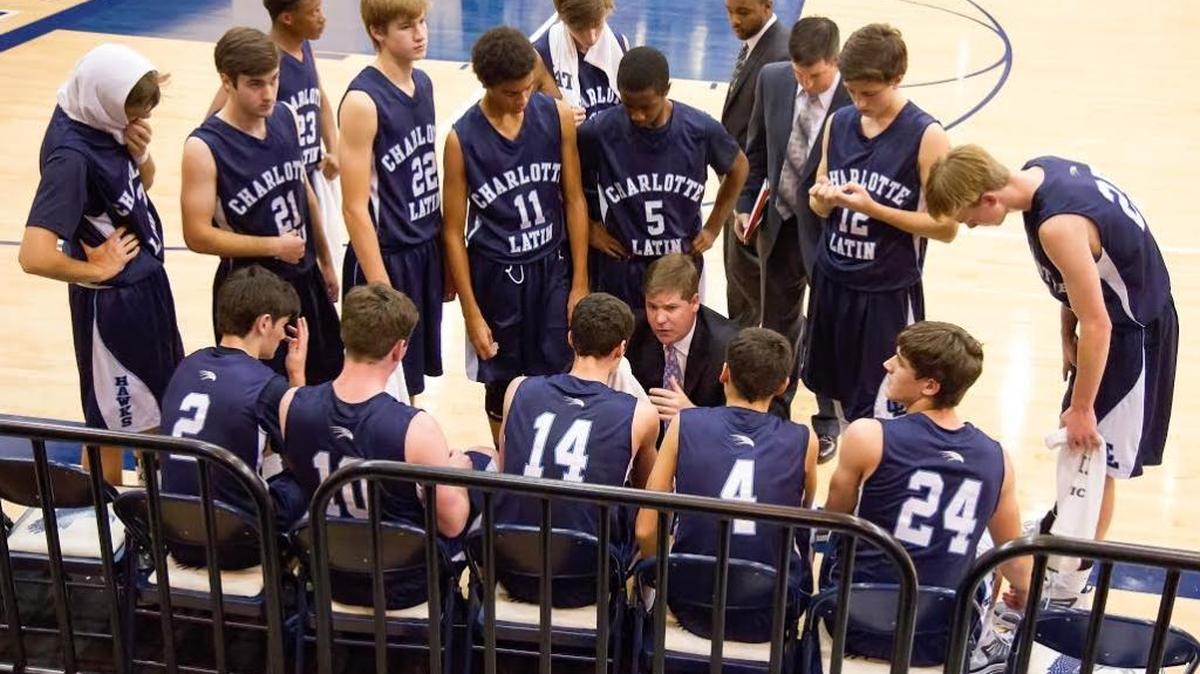 Charlotte Latin’s boys, led by coach Chris Berger (center), are No. 12 in the Observer’s preseason Sweet 16