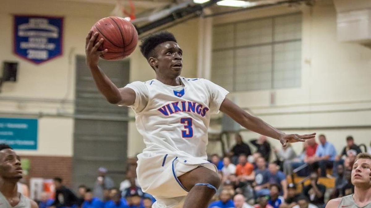 North Meck's Vaud Worthy (#3) glides down the lane for a 2 points during early half action. North Meck would host Northwest Guildford in the second round of the NCHSAA playoffs friday night February 23, 2016