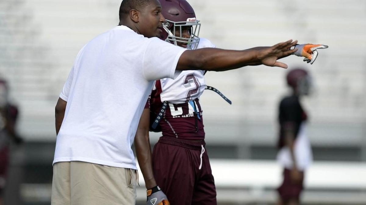 West Meck head coach Jarvis Davis pointed the way to a 55-0 win over Garinger on a rainy Thursday night