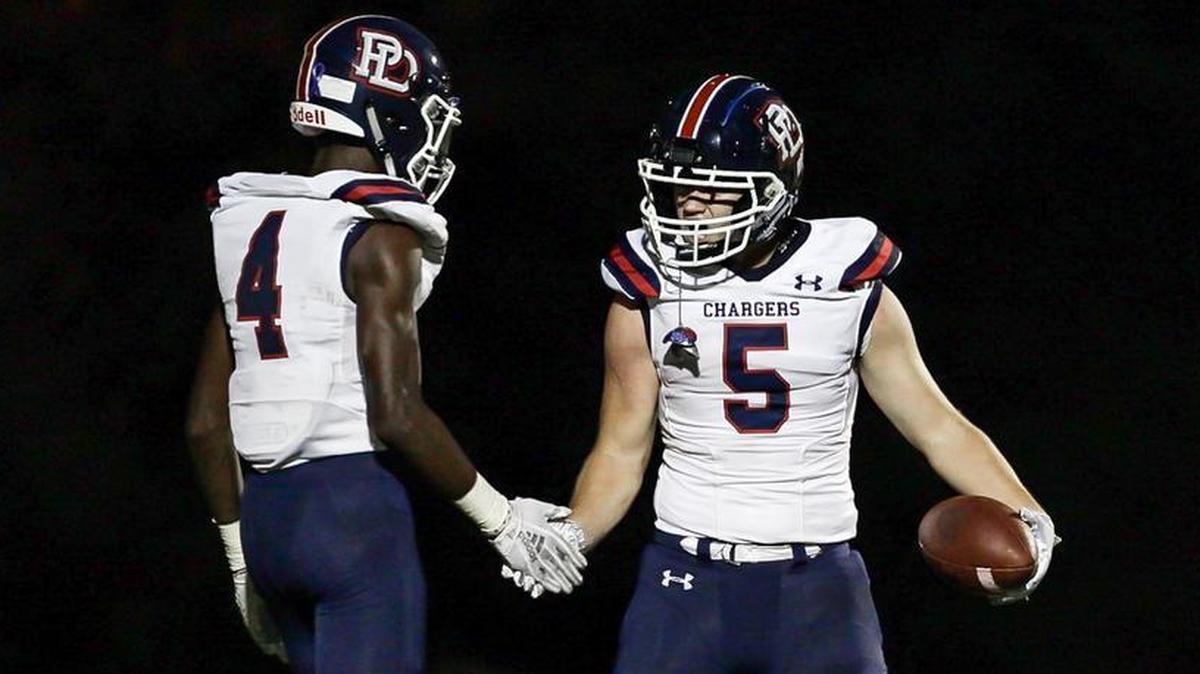 Providence Days’ Parker McRae (5) celebrates a touchdown pass in the second quarter of Friday’s 42-6 win over Charlotte Country Day.