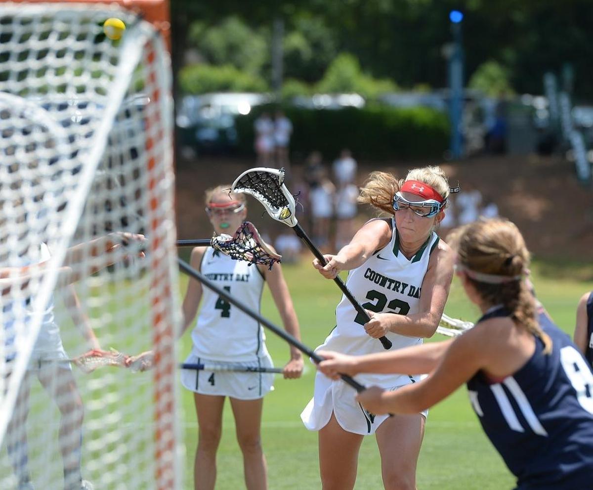 Charlotte Country Day's #22 Carter Williams scores a goal as The Charlotte Country Day girls lacrosse team wins over Charlotte Latin at the NC Independent Schools state girls lacrosse championship Saturday at Country Day.