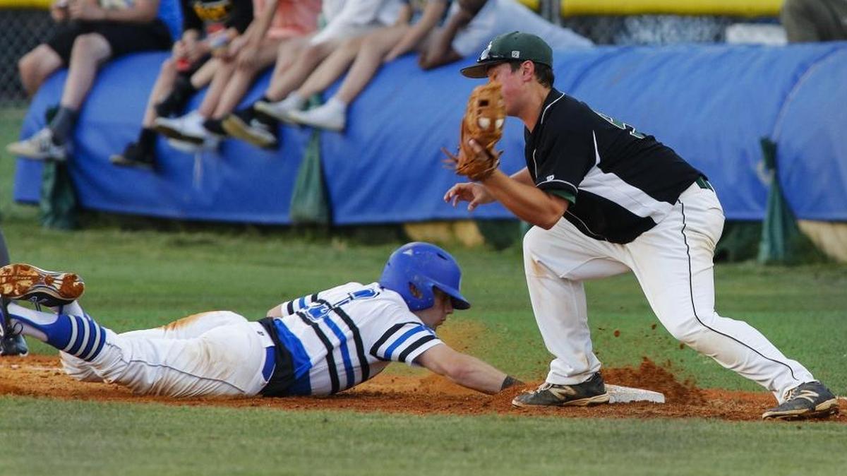 Charlotte Christian baserunner John Turley, left, dives back to first base against Charlotte Country Day's first baseman Ben Williams in NCISAA playoff baseball game in Charlotte, N.C., Friday, May 13, 2016. (Nell Redmond photo)
