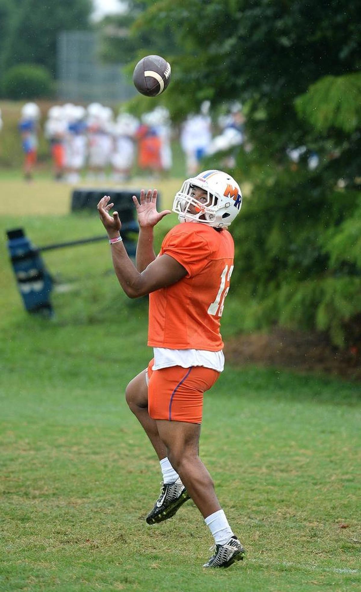 Caleb Deveaux, 17, a running back and linebacker for Marvin Ridge High School, comes from a family of college football players.
