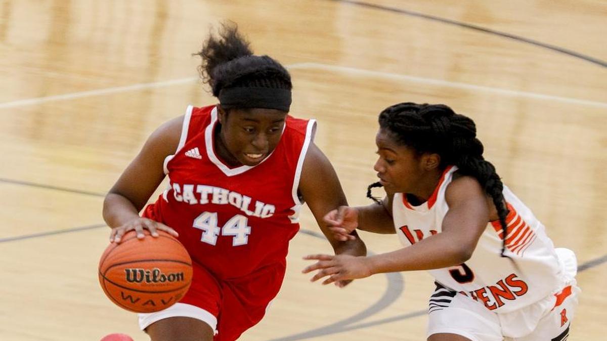 Charlotte Catholic's Kristal Mainsah, left, brings the basketball upcourt against Rocky River guard Courtney Meadows during the first half of a high school basketball game at Rocky River in Mint Hill, N.C., Tuesday, Dec. 20, 2016. (Nell Redmond photo)