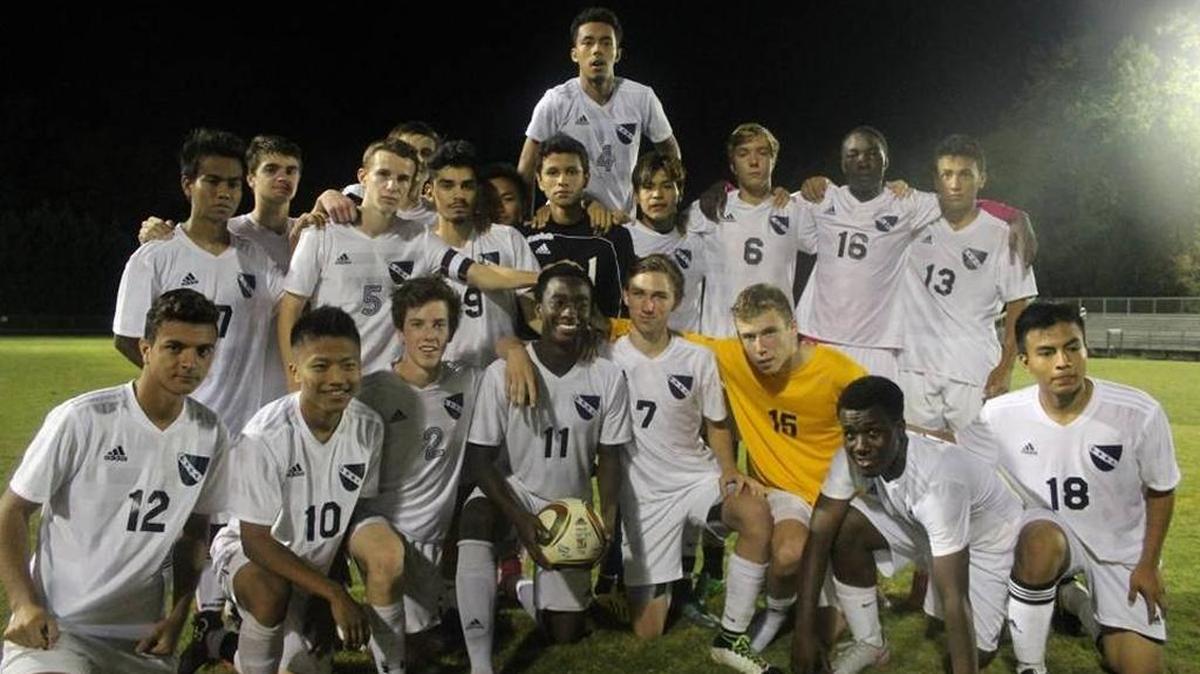 
East Mecklenburg’s Charles Basse (center of front row, holding ball) had six goals in Wednesday’s match against Rocky River. 
