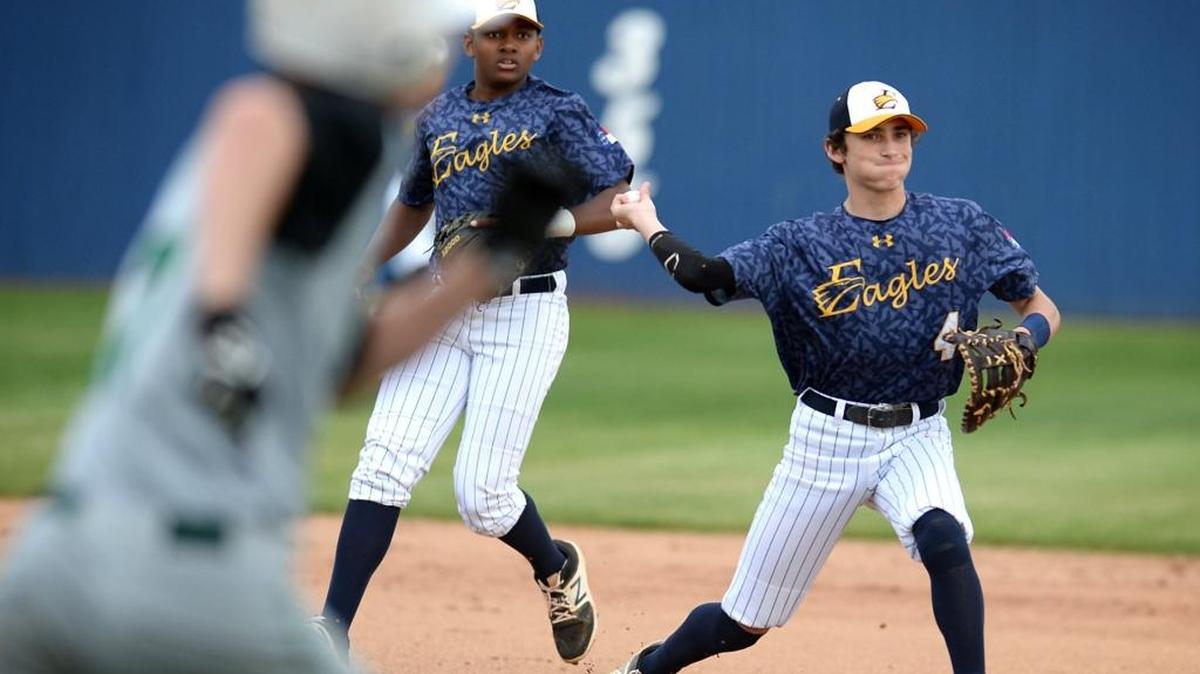 East Meck first baseman Will Leatherwood fields a ball and throws out a Myers Park runner during prep baseball action on Tuesday, March 28, 2017 at East Meck High School.