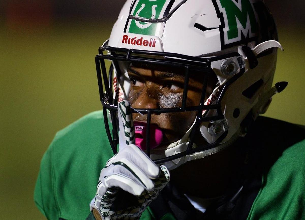 Myers Park wide receiver Muhsin Muhammad looks to quiet the crowd after catching a touchdown pass against Butler during first-half action on Friday, Oct. 6, 2017 at Myers Park High School.