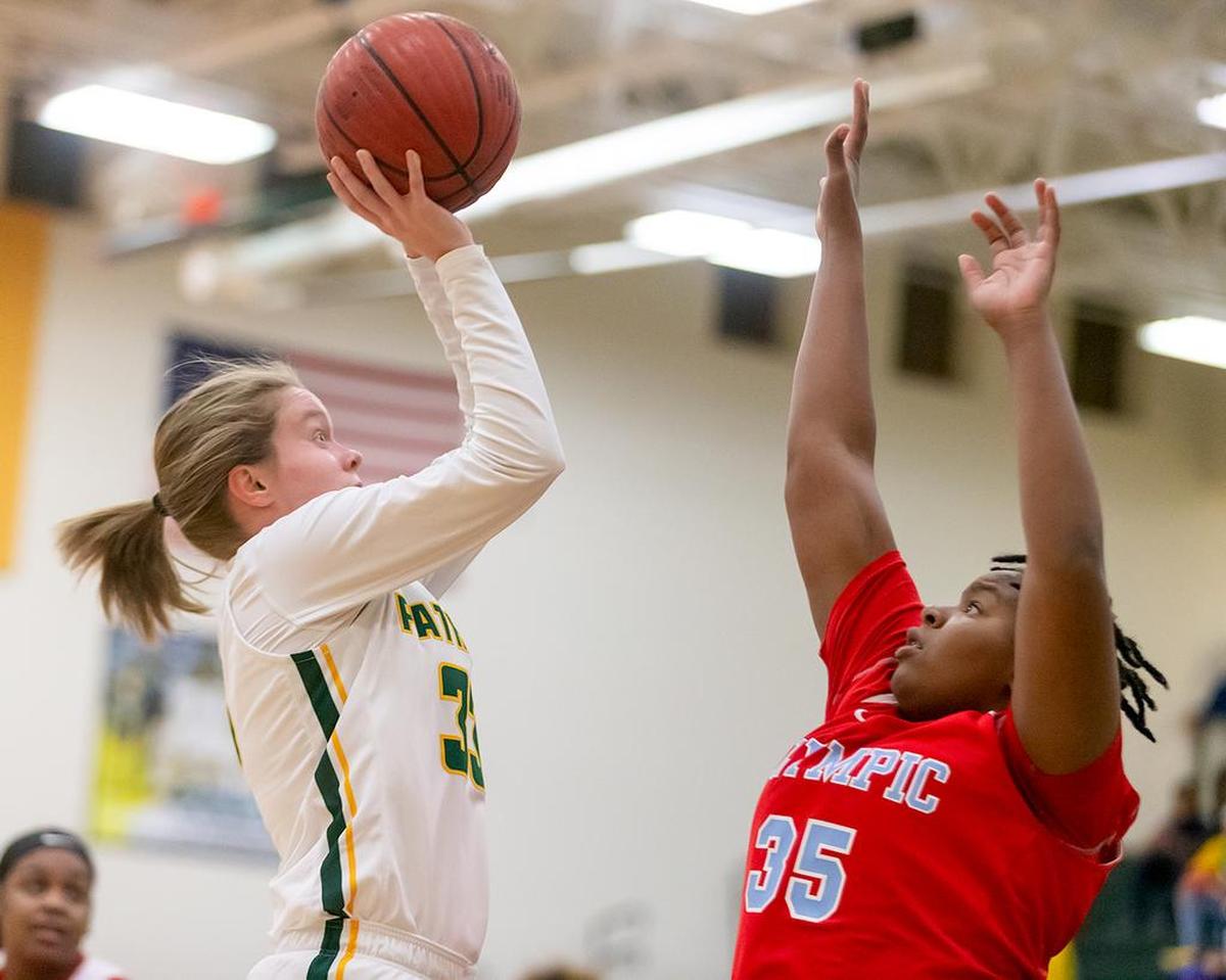 An Independence High player goes up for a jump shot against Olympic