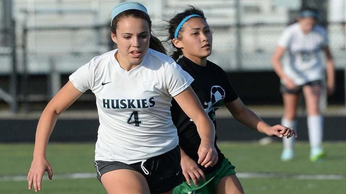 Hough high's freshman Ashlynn Serepca on left, moves the ball towards the goal during Tuesday's soccer match played at Hough High School April,28,2015. Hough defeated A.L. Brown 9-0.