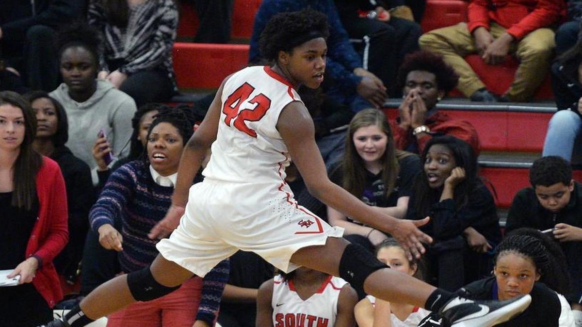 South Meck's A'lea Gilbert, left, hangs suspended in the air as she attempts to disrupt a pass from Ardrey Kell's Deniyah Lutz, right, on Friday, January 15, 2016 at South Meck High School. Ardrey Kell defeated South Meck 55-50.