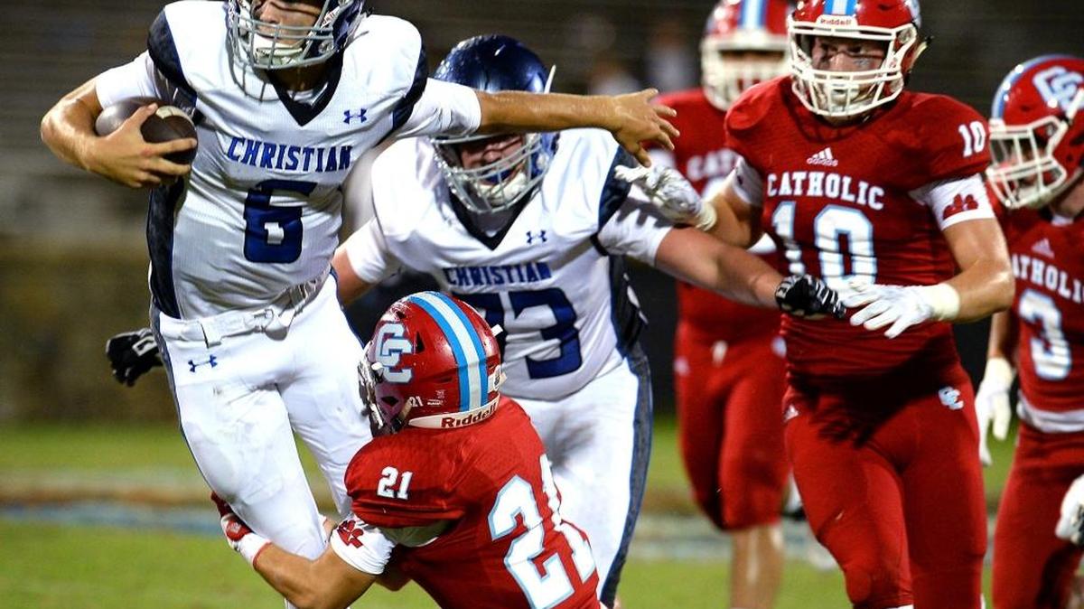 Charlotte Christian quarterback Garrett Shrader (left), shown last season against Charlotte Catholic, will again lead the Knights against the Cougars Friday night. Shrader passed for more than 2,500 yards last season as a sophomore.