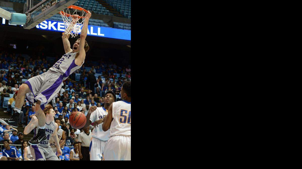 
Ardrey Kell's Steven Santa Ana (22) throws down a two-handed dunk vs Garner during the NCHSAA 4A Boys Championship game at the Dean E. Smith Center in Chapel Hill, NC on Saturday March 14, 2015. Garner defeated Ardrey Kell 70-64. Santa Ana scored 44 points in the game
