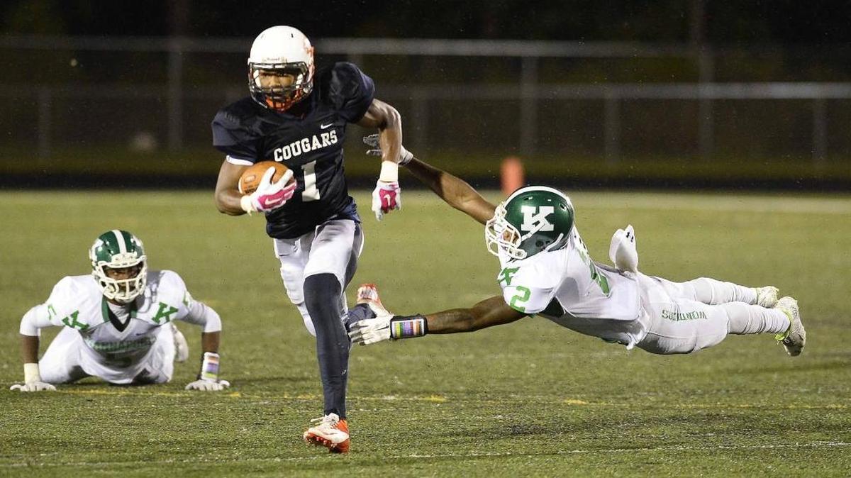 Vance High's wide receiver Myles Dorn on left, carries the ball down field pulling away from A.L. Brown's linebacker Steven Howie earlier this season