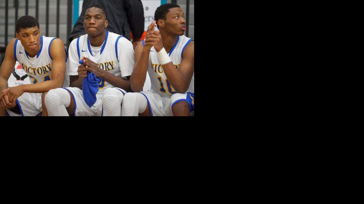 
Victory Christian's Ebuka Izundu (center) with teammates Brent Davis (left) and Terry Alston lost a close game to the Burlington School in Saturday’s NCISAA 1A state final in Asheville
