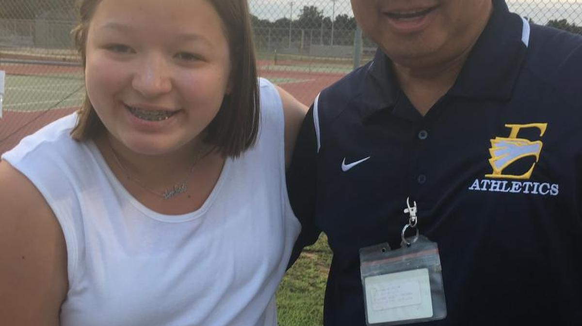 Amber Nee, left, and East Meck girls’ tennis coach Thomas Nguyen