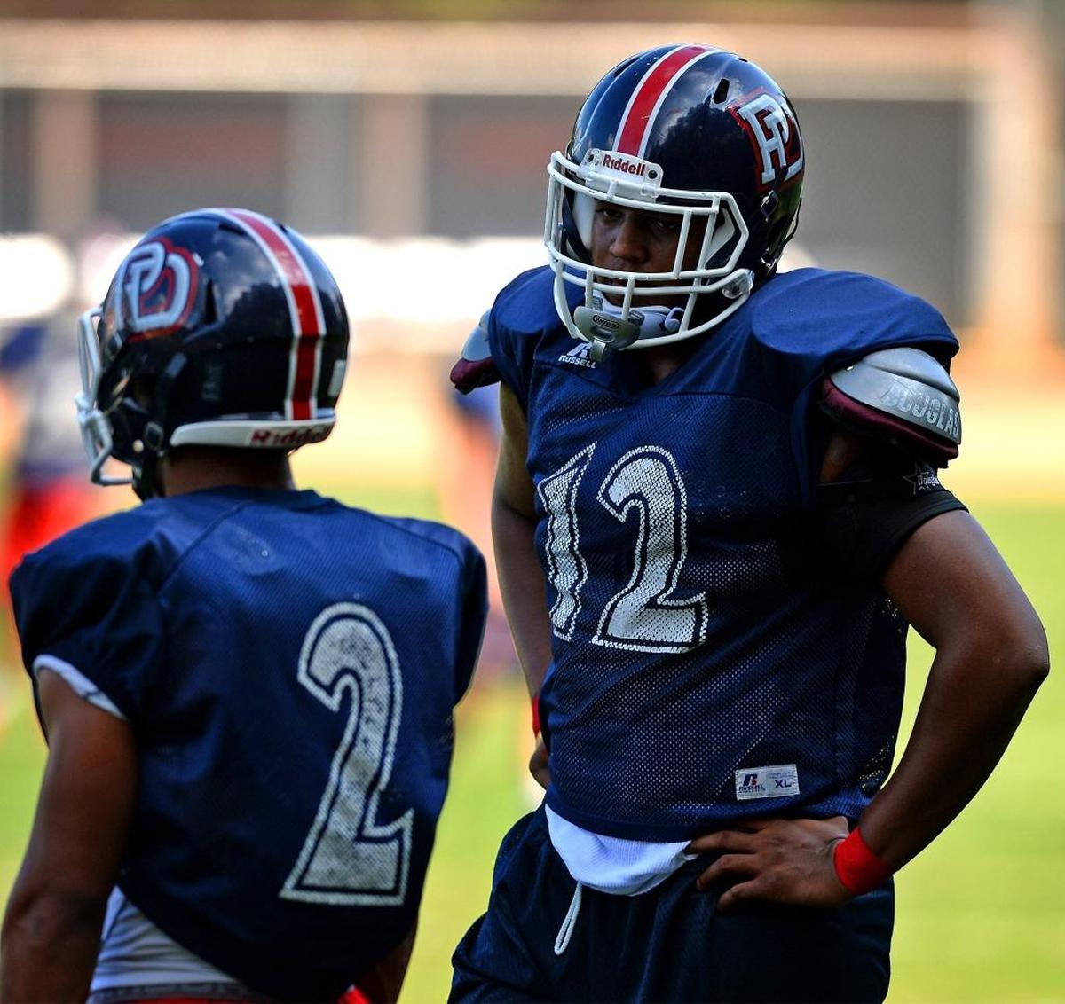 Providence Day lineman Jacolbe Cowan, right, had three sacks against nationally ranked Charlotte Christian last week.