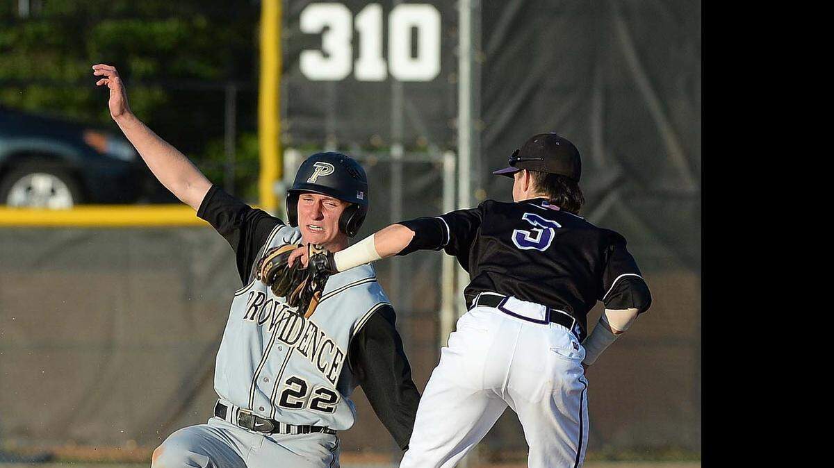 
Providence high's runner Trevor Rhyne (left), makes it safe to second base after stealing first base, Ardrey Kell's infielder McKinnon Garner (right), makes the tag too late during Tuesday's game played at Ardrey Kell high school April 21, 2015.
