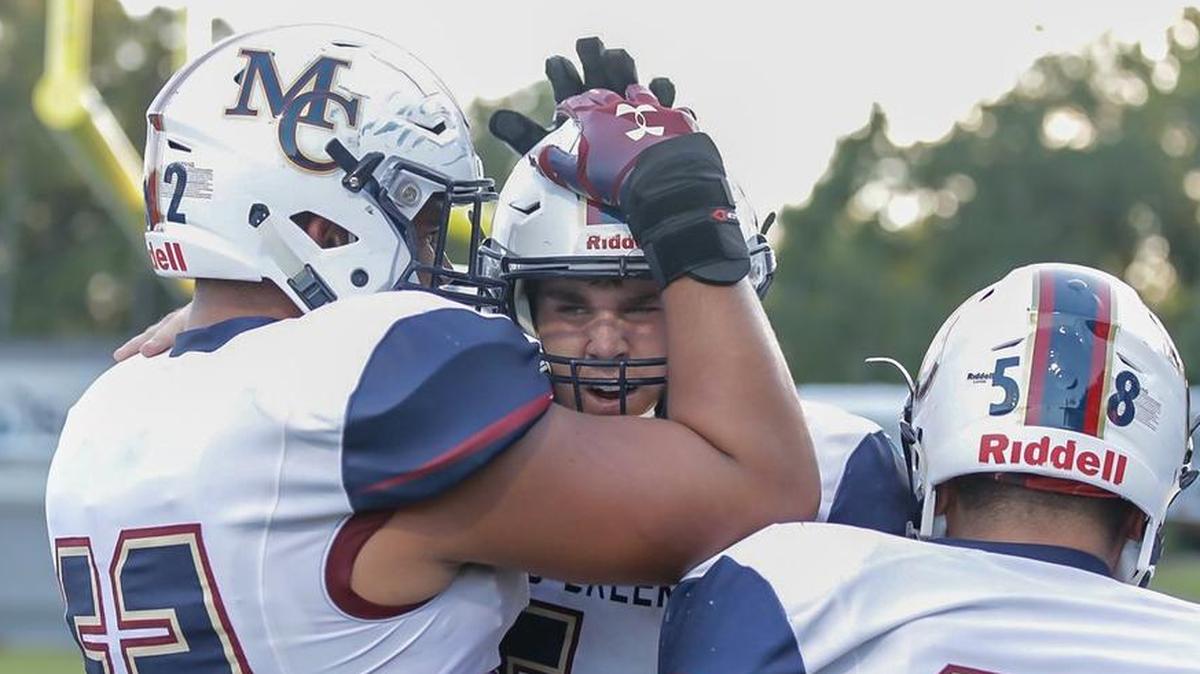 Mallard Creek High quarterback Casey Kelly (center), pictured earlier this season against Butler, completed 11 of 24 passes for 205 yards and threw for two tuchdowns to lead the Mavericks to a 20-7 victory over Vance Saturday night at Richardson Stadium.