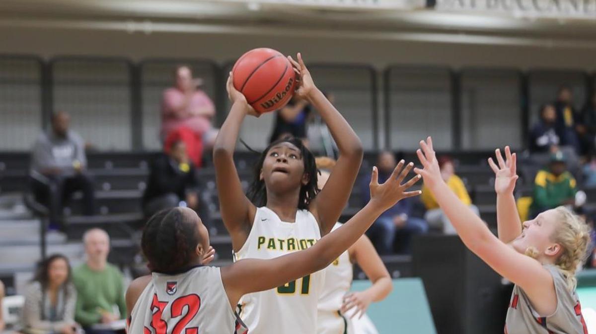Independence's Ayanna Anderson (center) shoots and scores a two point basket at the BSN Sports Queen City Clash December 21, 2017.