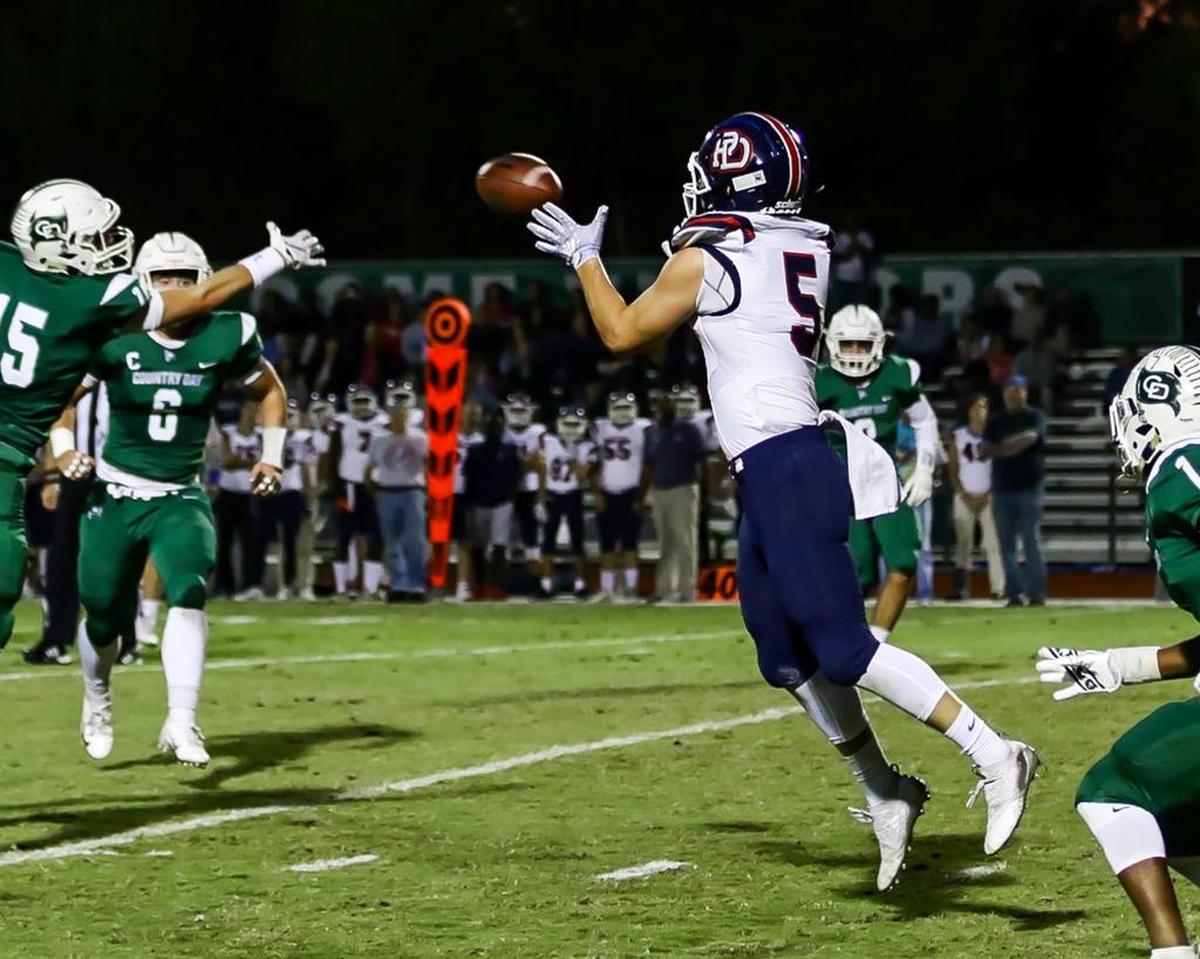 Providence Day’s Carter Dowling (5) catches a first down pass early in Friday’s 42-6 win at Charlotte Country Day.