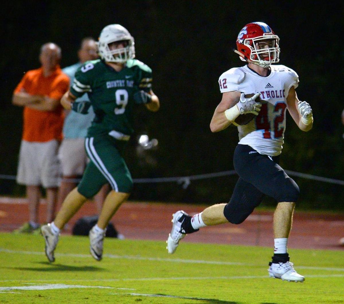 Charlotte Catholic's Michael Neel, right, is a Charlotte Observer high school football player of the week.