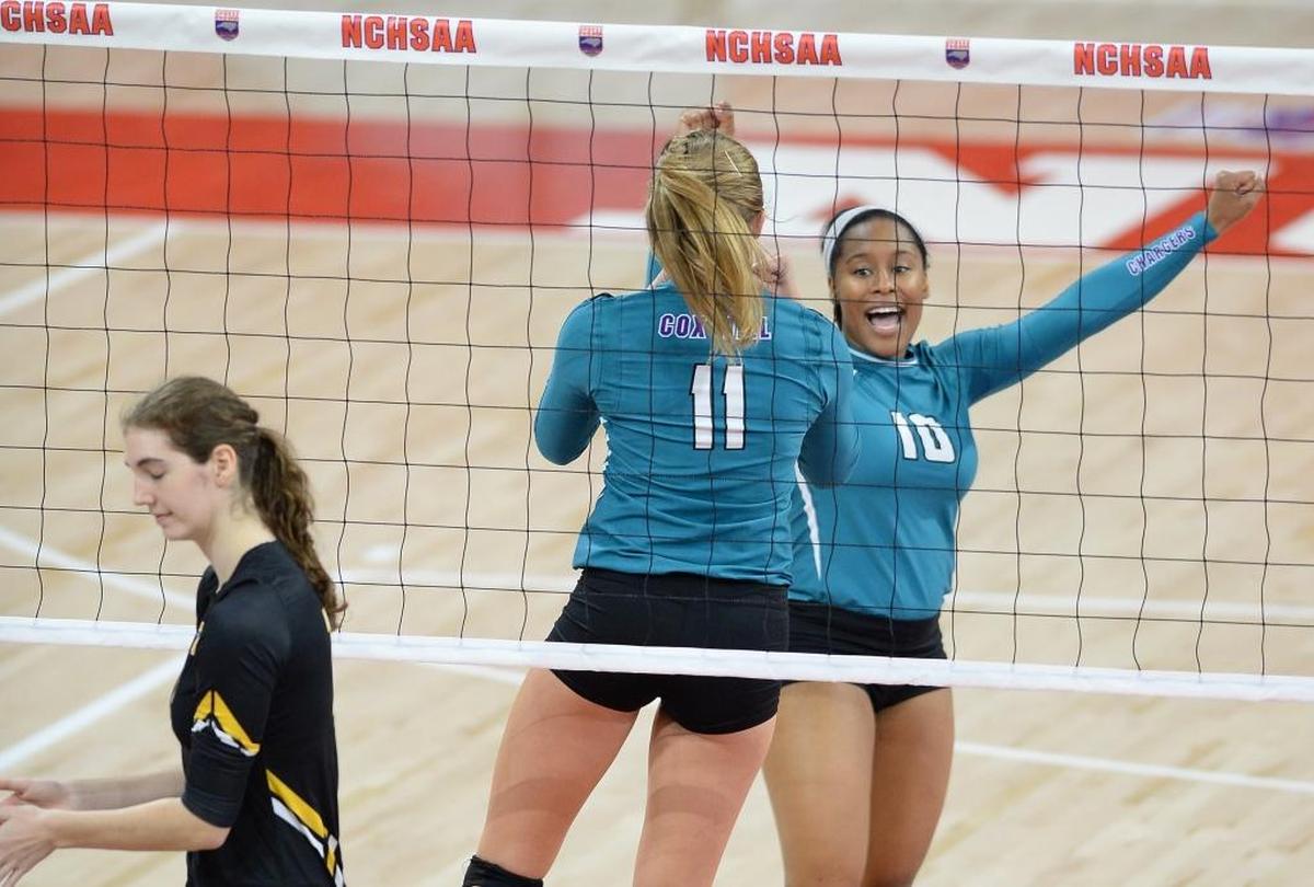 Melanie Jones (10) and Courtney Weber (11) of Cox Mill celebrate a point for the Chargers in last season’s N.C. 3A state final game