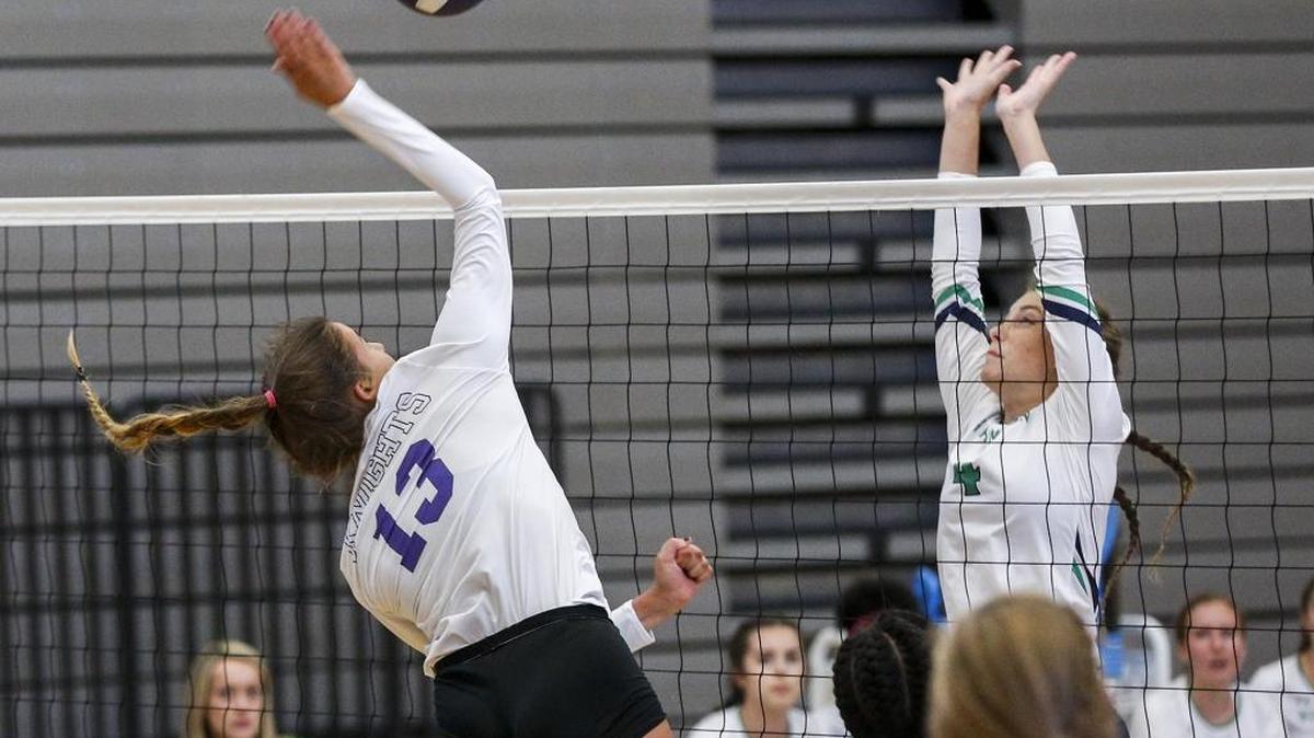 Ardrey Kell’s Sylvia Duggan, left, makes a play during Tuesday night’s volleyball match as Weddington’s Gabby Barajas defends. Duggan had 16 kills and host Ardrey Kell won 26-24, 25-16, 25-14 in the season opener.