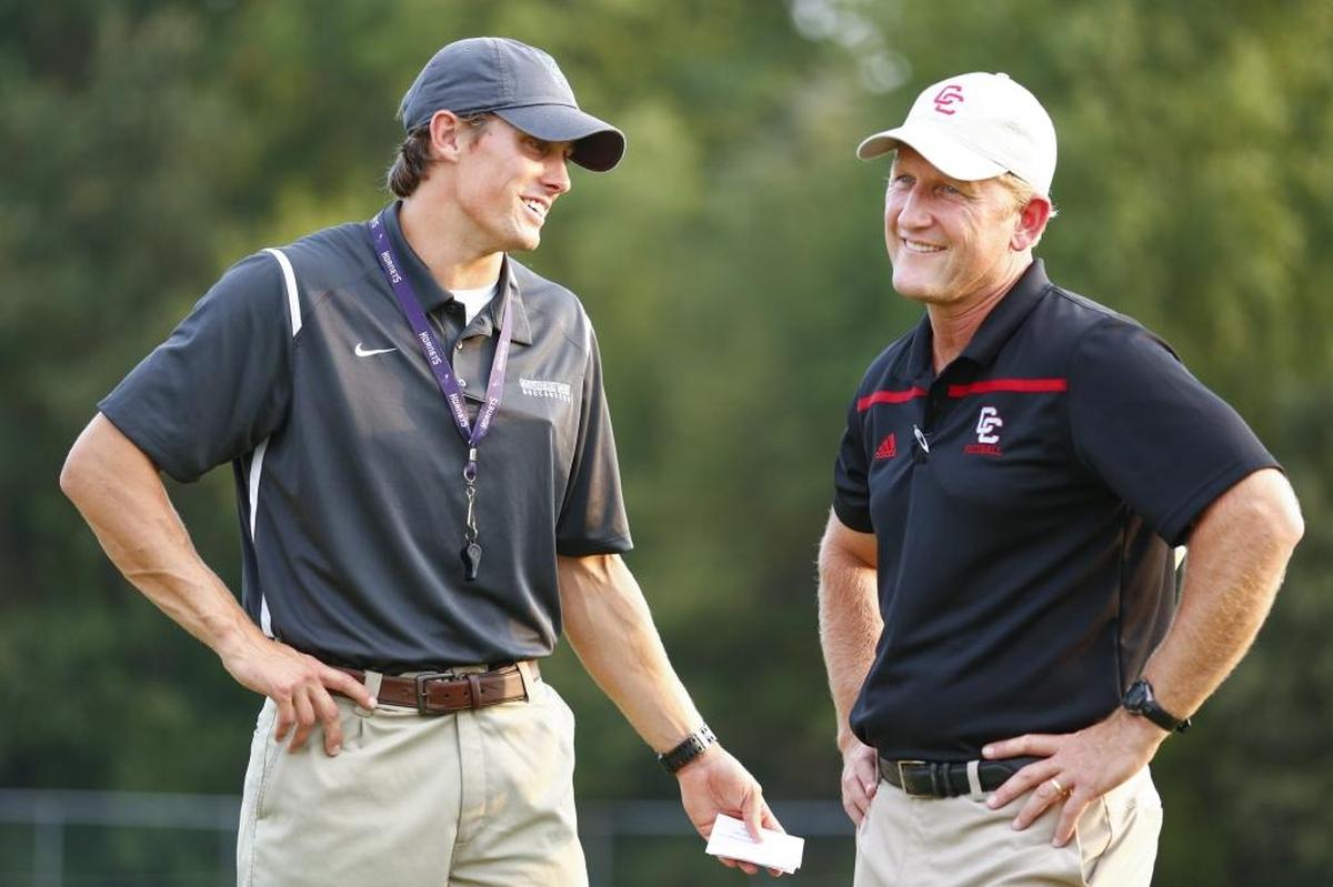 Charlotte Country Day coach Drew Whitman, left, and Charlotte Catholic’s Mike Brodowicz may not watch their teams meet on the field in 2019. Barring a late scheduling change, the Country Day-Catholic rivalry will not be played this fall.