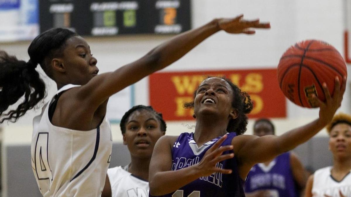 Ardrey Kell guard Journey Muhammad, right, shoots against Mallard Creek guard Emya Price in the Charlotte Hoops Challenge at Berry High in Charlotte, N.C., Saturday, Nov. 25, 2017. (Nell Redmond photo)