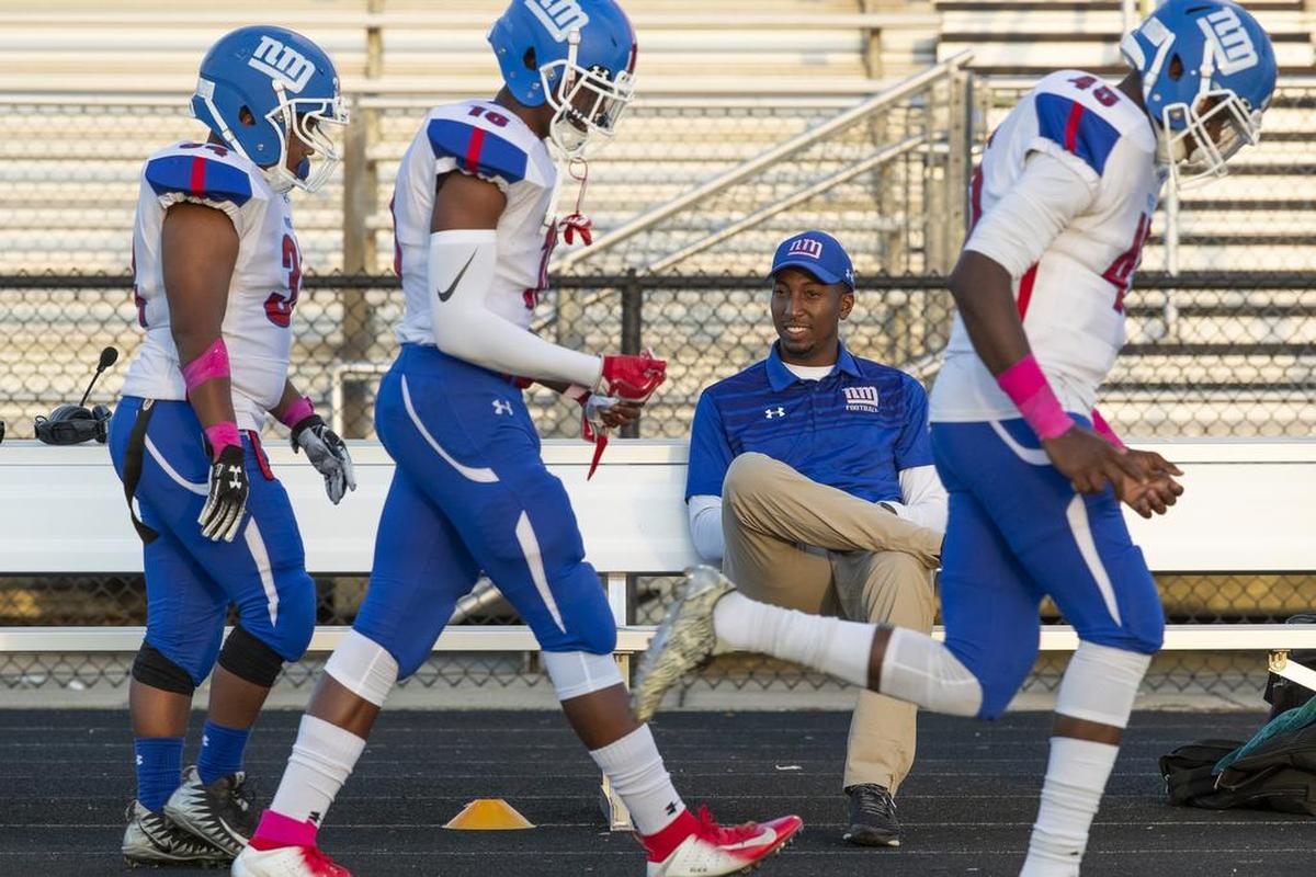 North Mecklenburg coach Eric Morman watches his players arrive for Friday’s I-MECK 4A conference game at Hough.