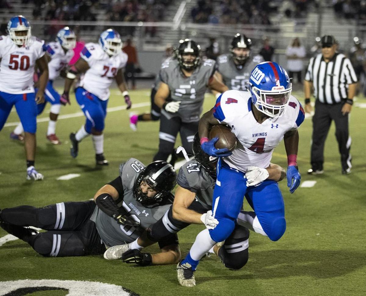 North Meck running back Fabian Duncan moves the ball downfield while facing Hough during a prep football game at Hough High School Friday, October 19, 2018 in Cornelius, NC. Photo by JASON E. MICZEK - Special to the Observer