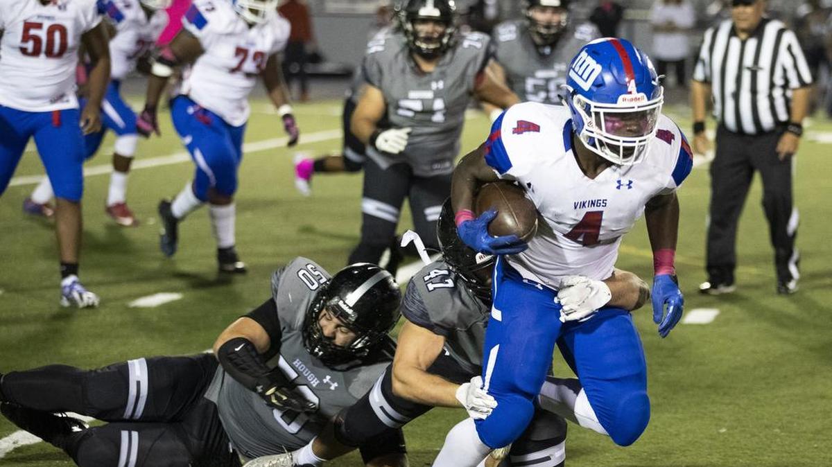 North Meck running back Fabian Duncan moves the ball downfield while facing Hough during a prep football game at Hough High School Friday, October 19, 2018 in Cornelius, NC. Photo by JASON E. MICZEK - Special to the Observer