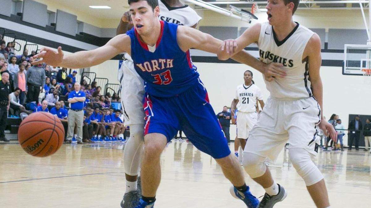 North Meck's Ethan Waker (33) dives for a loose ball while facing Hough during a MECKA conference prep basketball game Friday, January 8, 2016 at Hough High School. North Meck won 68 - 63. Photo by JASON E. MICZEK - Special to the Observer