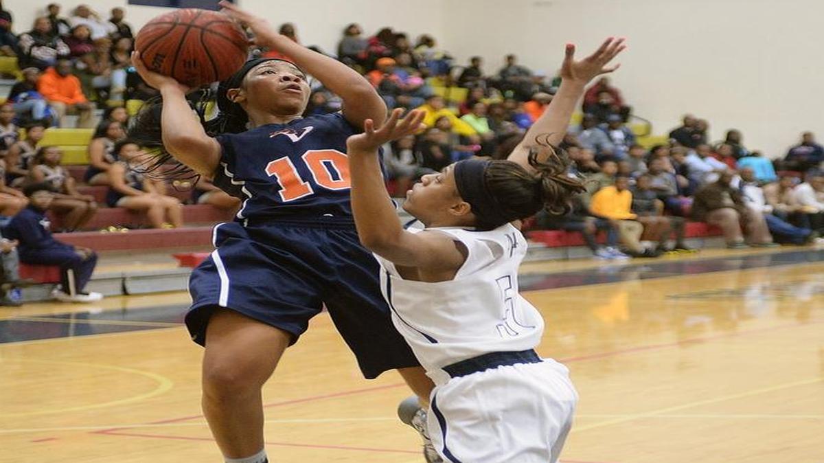 Mallard Creek Mavericks girls varsity play Vance Cougars in Friday's prep basketball game at Mallard Creek high. Vance Cougars #10 Dazia Lawrence goes for the jump shot to score over Mallard Creek Mavericks #5 Kala Brown