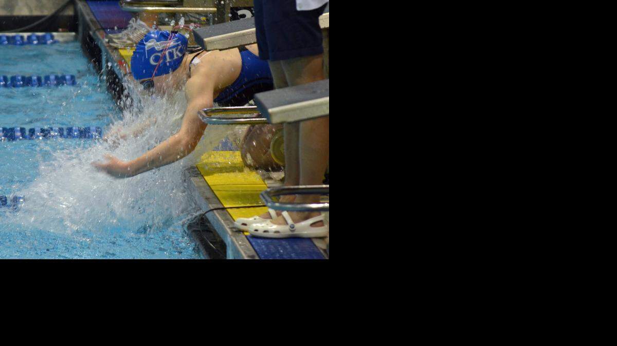 
Jane Donahue, a sophomore at Christ the King Catholic High School in Huntersville, goes through her pre-race ritual before the start of the girls’ 200-yard individual medley finals at the NCHSAA 1A/2A state swimming and diving championships. Donahue won the event – the first state title for Christ the King – and finished second in the girls 100-yard breaststroke despite missing most of the season because of injuries. 
