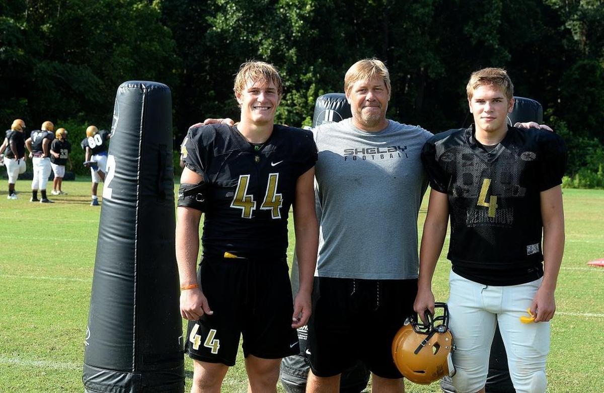 Former Shelby High All-American linebacker Dax Hollifield (left) is now playing at Virginia Tech. His father, Aubrey (middle) is Shelby’s basketball coach. Baby brother, Jack (right) was named a MaxPreps sophomore All-American after the 2018 season.