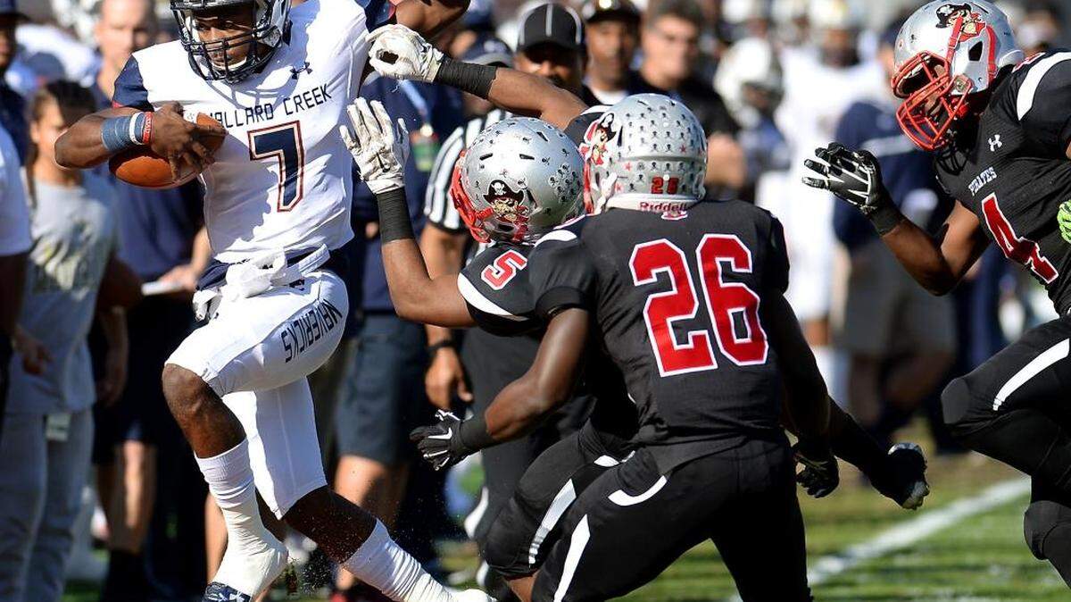 Mallard Creek quarterback James Smith, left, was named championship MVP in the Mavericks’ 49-6 win Saturday against Greensboro Page in the N.C. 4AA championship in Raleigh.