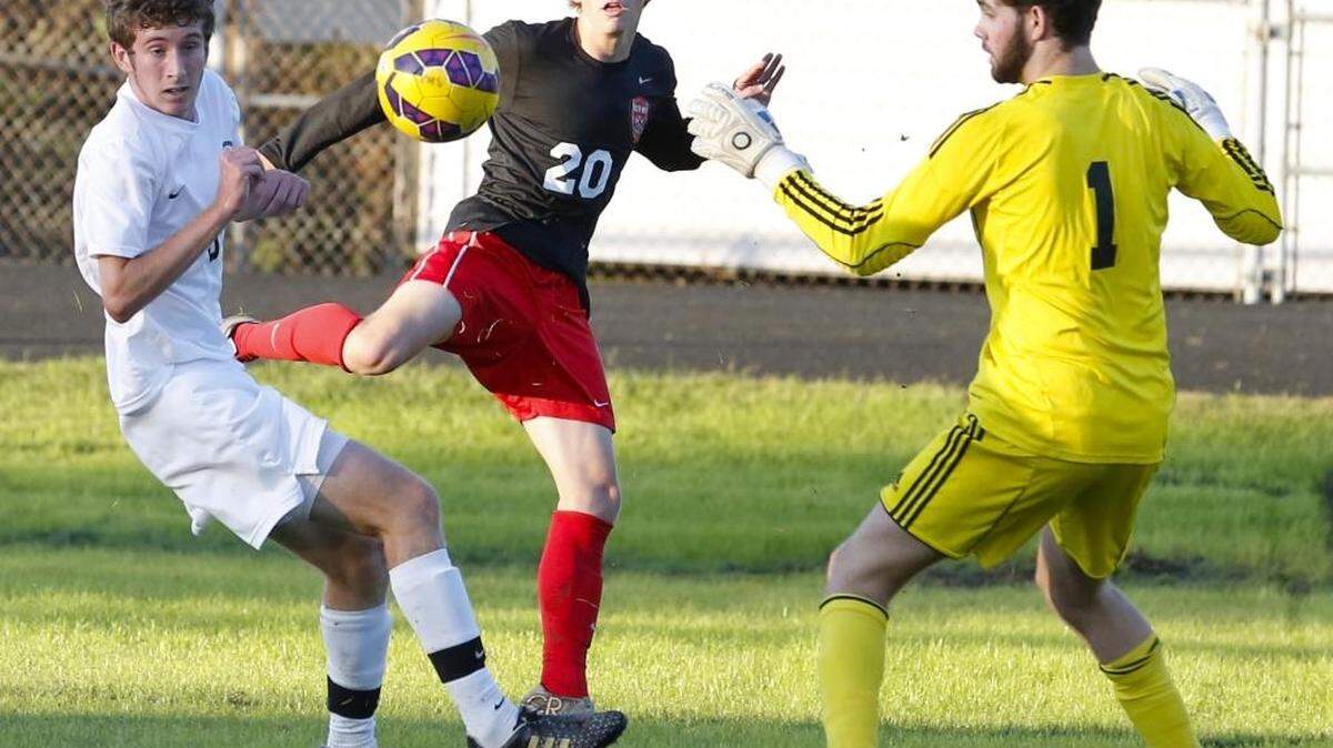 
South Meck's Reed Hunnicut (20) tries to get the ball close to the goal while facing Providence during a prep soccer match at Providence High School Tuesday, October 13, 2015. 

