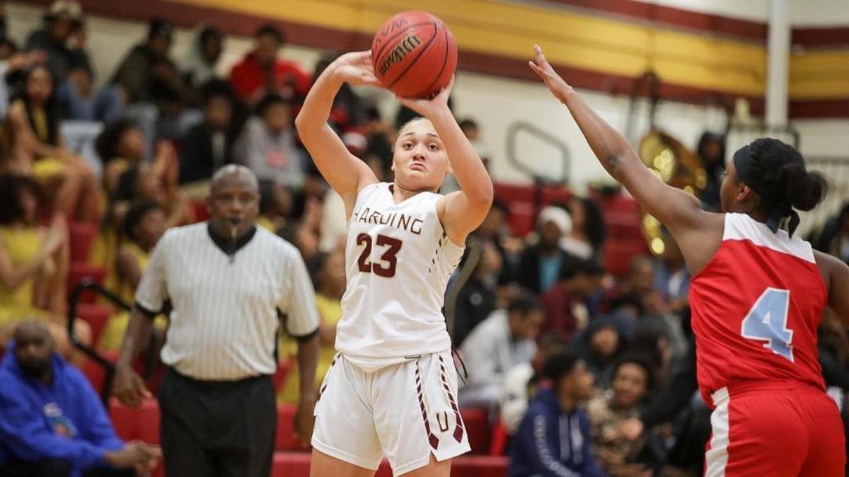 Harding's Trinity Thompson (23) shoots a 3-pointer during Friday’s game against Olympic.
