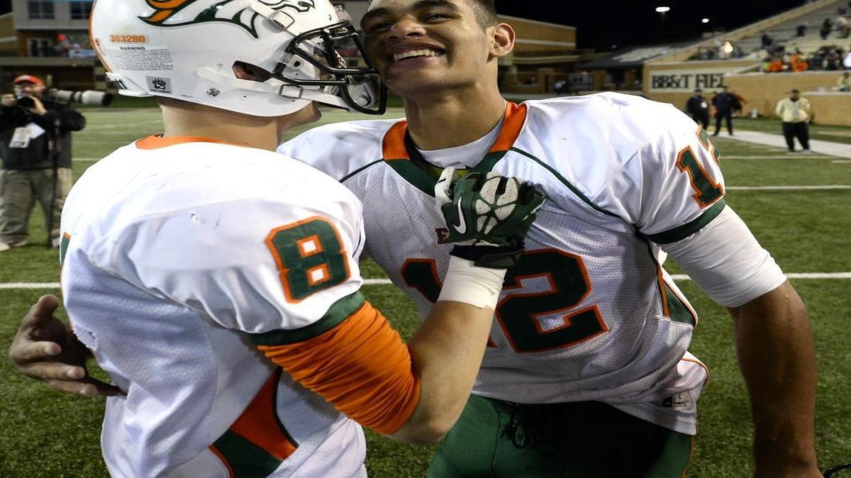 East Lincoln Mustangs quarterback Chazz Surratt (12) was medically cleared to play in Friday’s N.C. 2AA home quarterfinal against East Burke.