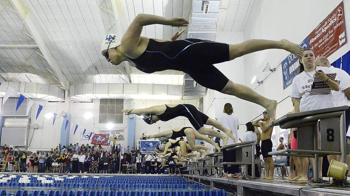 Kalyn Fetter, a senior at Lake Norman High School in lane eight, flies from the blocks in heat three of the women's 200 yard IM Saturday. The NC 4A West regional swimming & NC 3A West regional diving championships were held at Huntersville Family fitness & Aquatic Center on Saturday, Feb.6, 2016.
