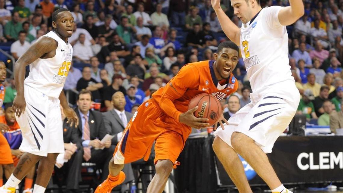 Former Clemson player Demontez Stitt, center, died Tuesday at his home in Charlotte.
