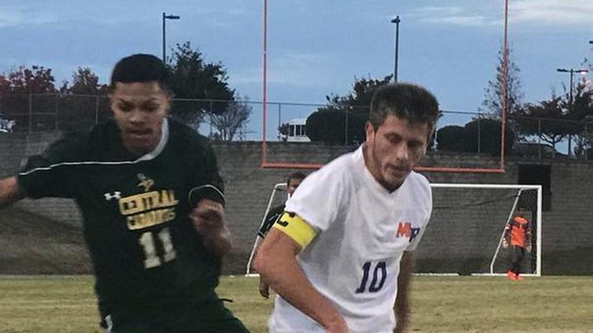 Marvin Ridge’s Hayden Green defending in the Mavs’ first round match Wednesday