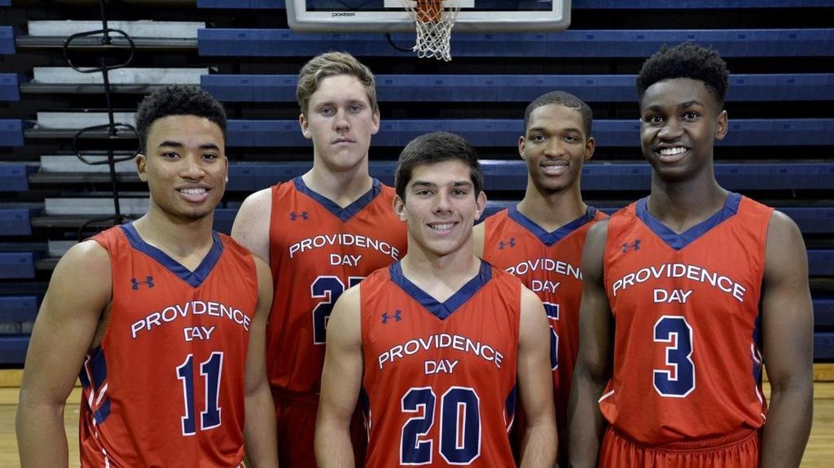 Providence Day boys basketball team, which played one of the toughest schedules in the nation last season, has ramped it up even more this season, including a 10-day trip to China. The Chargers hope for a fourth straight Final 4 appearance and a second state title in three years. Providence Day's starting five ( L to R) Devon Dotson, John Miralia, Kyle Wood, Isaac Suffren, Trey Wertz.