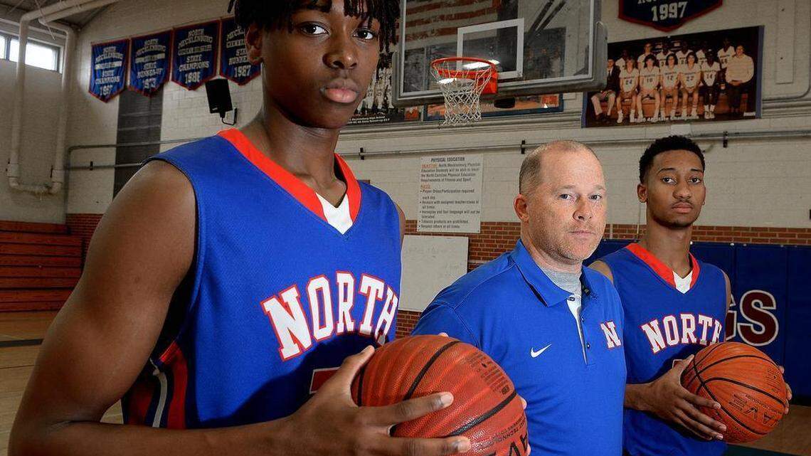 North Mecklenburg’s Jaylen McManus, left, coach Duane Lewis and Davion Mintz believe the Vikings have the potential to play for this season’s state championship.