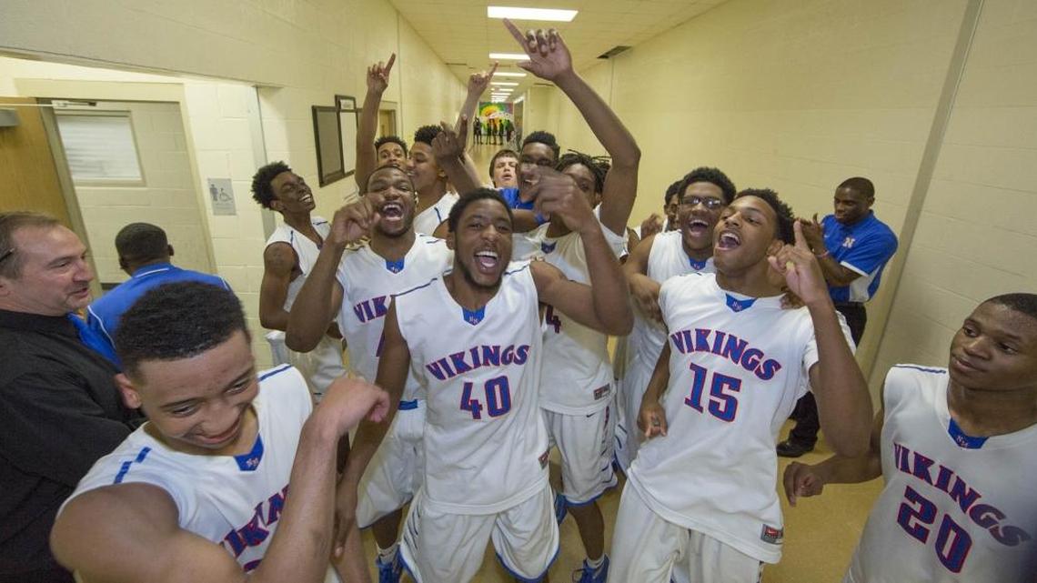 North Mecklenburg celebrates its win over Butler after an Elite 8 NCHSAA basketball playoff game Tuesday, March 1, 2016 at Hough High School in Concord, NC. Photo by JASON E. MICZEK - Special to the Observer