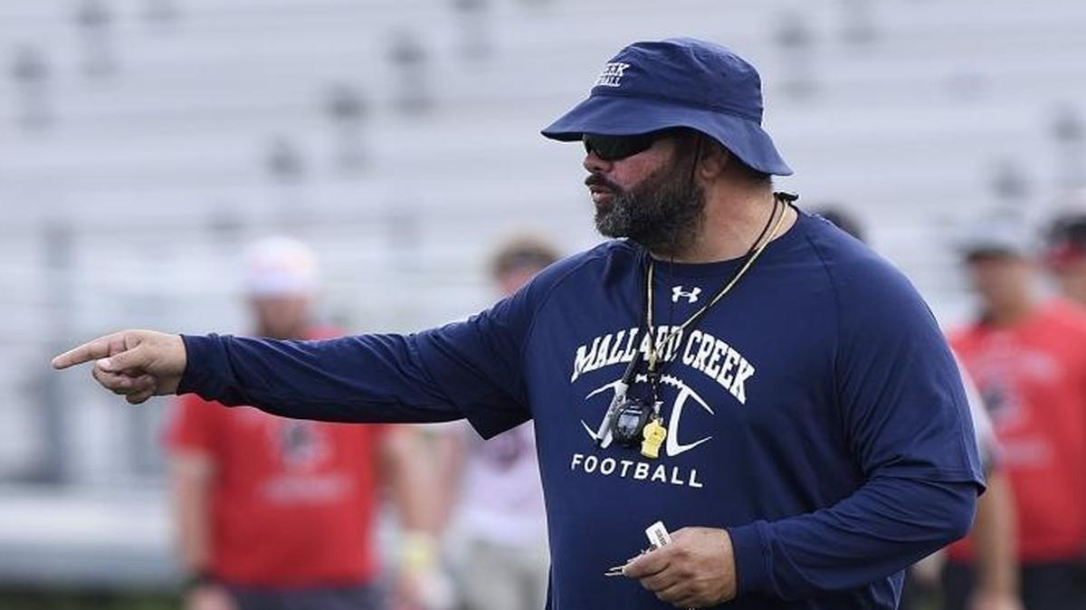 Mallard coach football coach Mike Palmieri directs the Mavericks during a scrimmage Wednesday morning against Fort Mill’s Nation Ford High. Palmieri is entering his 10th season at Mallard Creek, which has won three consecutive 4AA state championships.