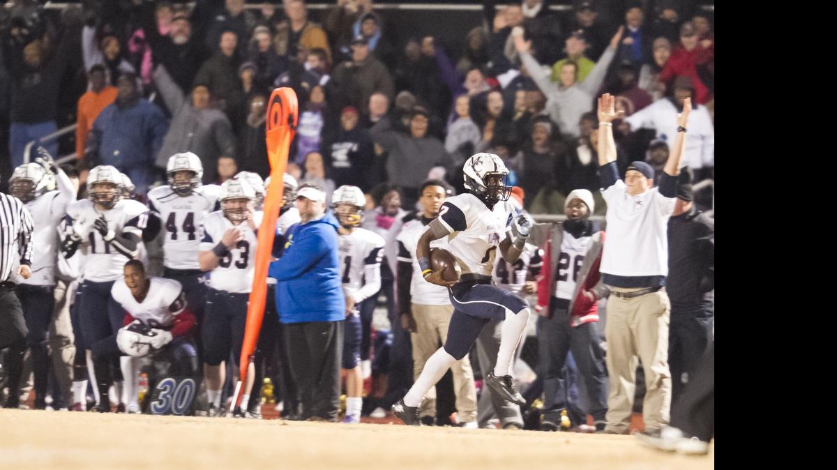 
Mallard Creek High quarterback James Smith runs for a touchdown early againat Lake Norman during the NC 4AA Western Regional Football Championship at Lake Norman High School in December. Smith and Mallard Creek beat Butler in a 7-on-7 tournament Tuesday. Photo by JASON E. MICZEK - Special to the Observer
