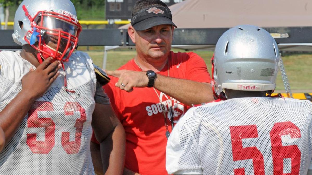 
South Pointe offensive line coach Mike Zapolnik (center) and the Stallions must replace all five offensive linemen this season.
